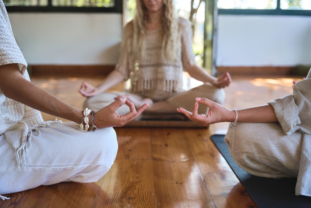 women practicing meditation at a wellness retreat in Phuket